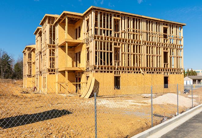 a close-up of temporary chain link fences enclosing a construction site, signaling progress in the project's development in Dorena OR